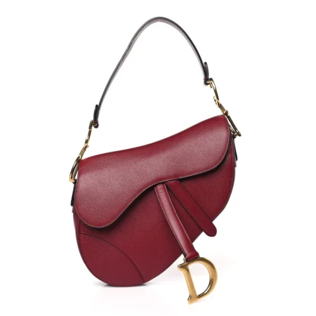 Front view of the red D!0r Saddle Bag with iconic curved silhouette and magnetic D stirrup clasp