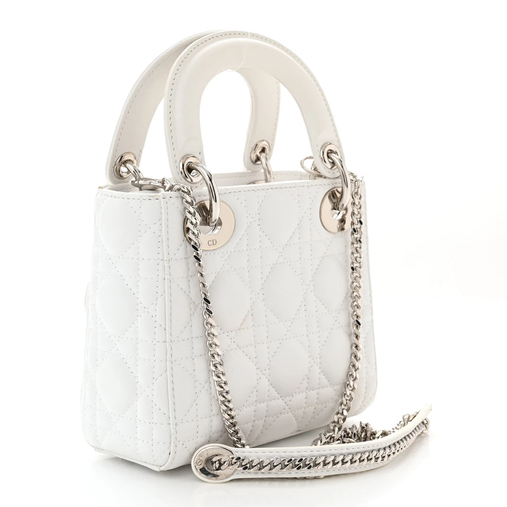 Back view of the white D!0r Mini Lady Dior Bag with Cannage stitching and silver-tone D.I.O.R. charms