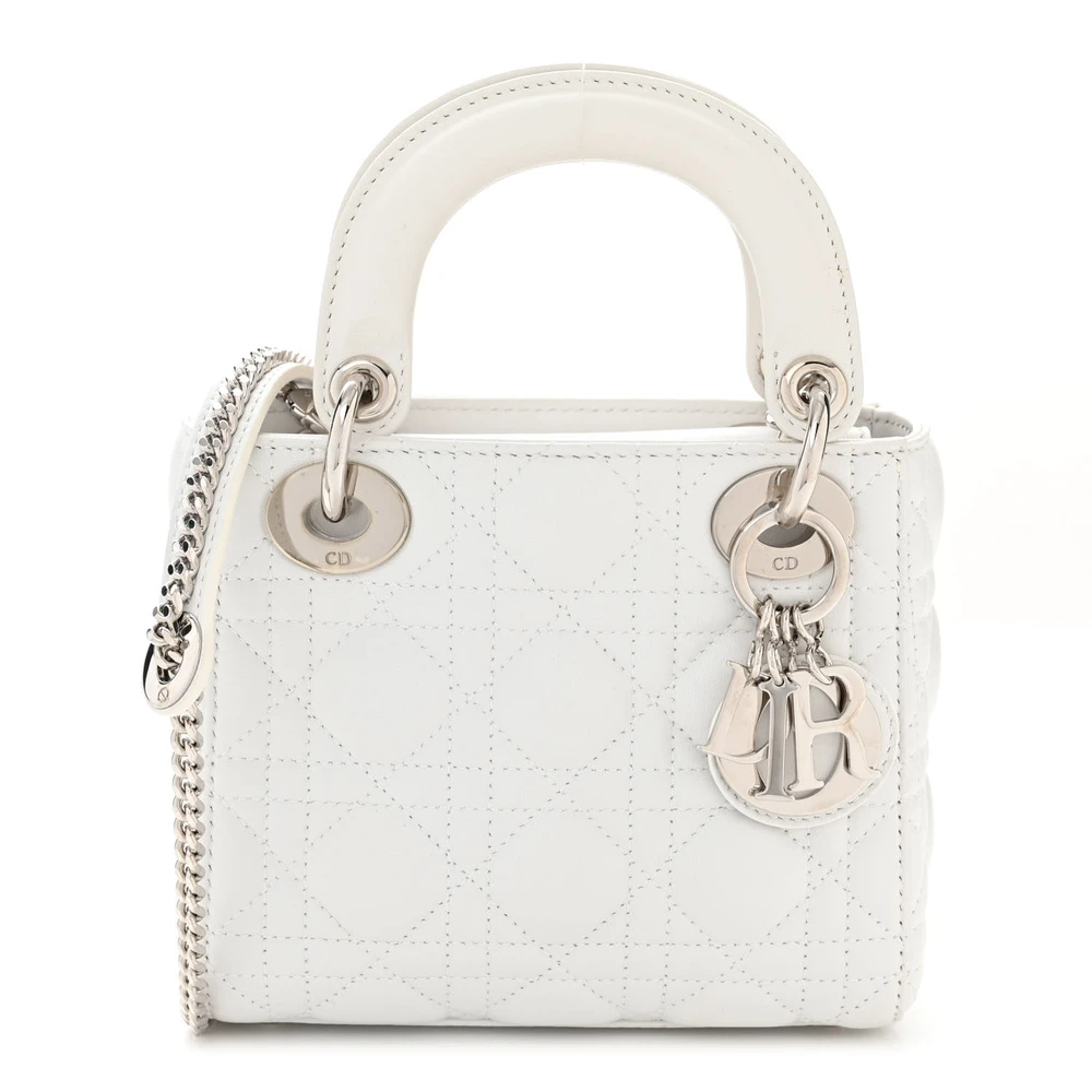 Front view of the white D!0r Mini Lady Dior Bag with Cannage stitching and silver-tone D.I.O.R. charms