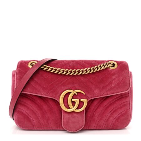 Front view of Mirror quality pink Gucc! GG Marmont shoulder bag with quilted velvet exterior and aged gold-tone GG logo