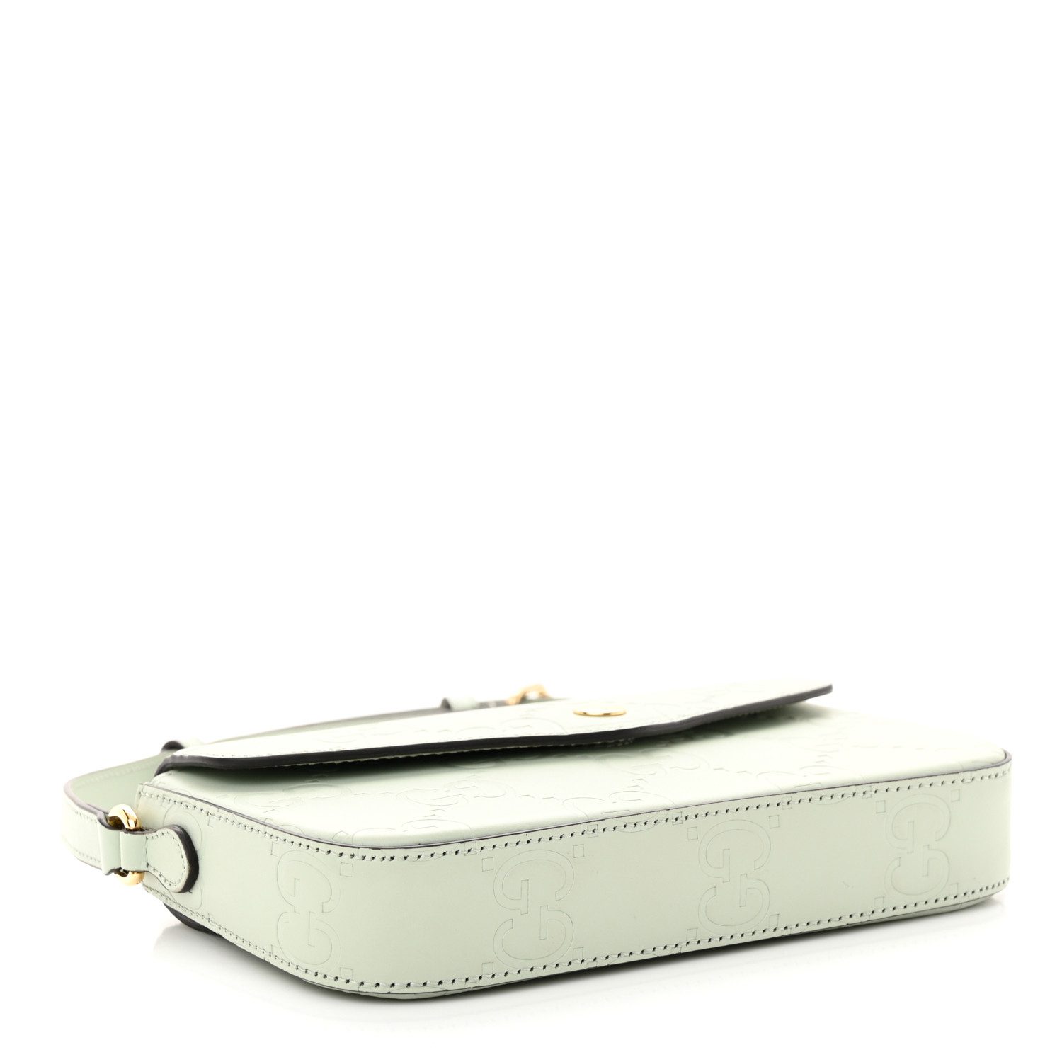 Back view of the pale green Gucc! GG Super Mini Shoulder Bag with embossed GG detailing