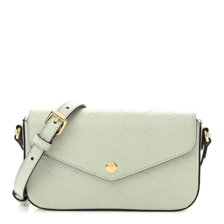 Front view of the pale green Gucc! GG Super Mini Shoulder Bag with embossed GG detailing