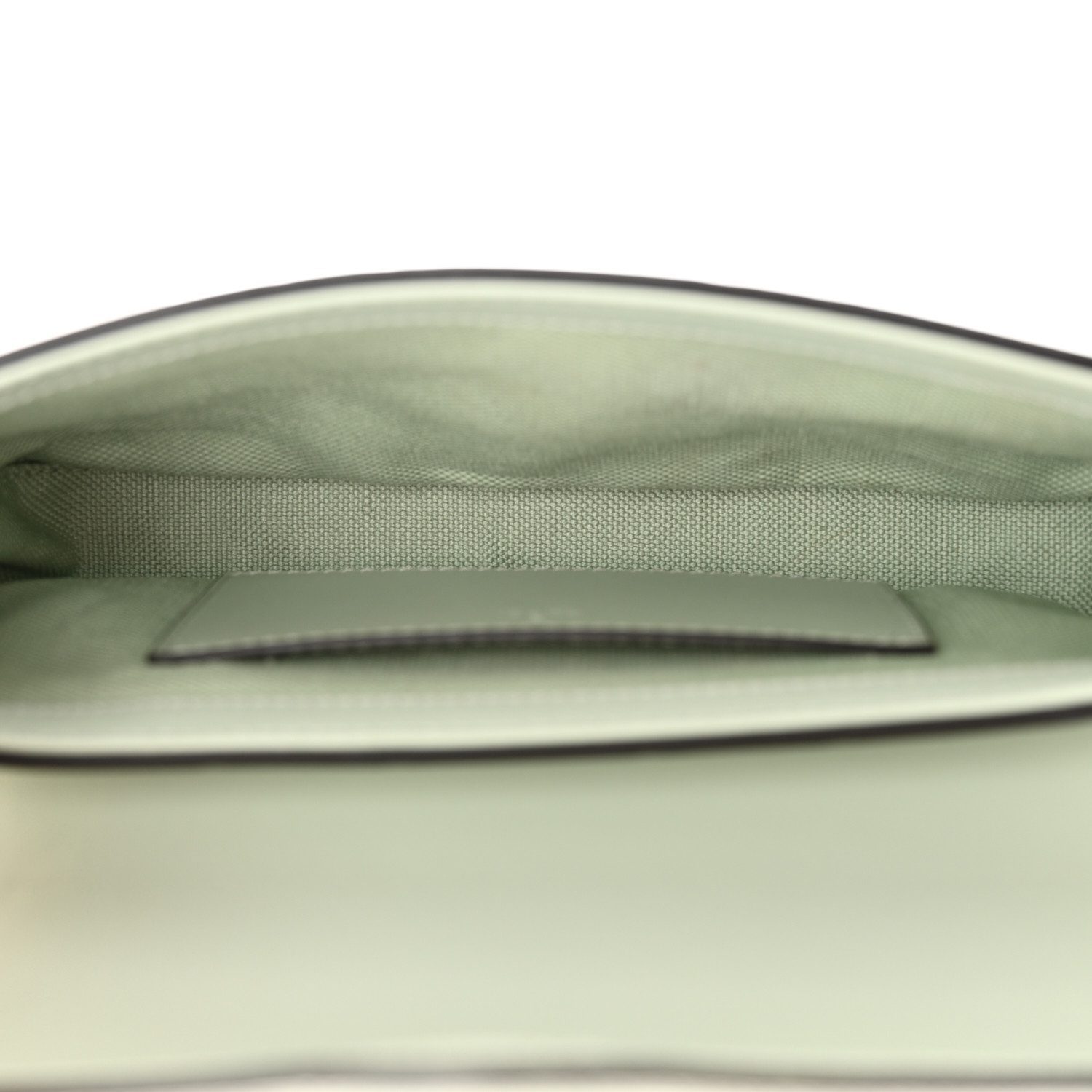 Interior of the pale green Gucc! GG Super Mini Shoulder Bag with matching green fabric lining and patch pocket