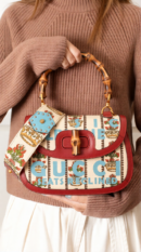 Model carrying the Gucci! Bamboo Medium 1947 Top Handle Bag with optional shoulder strap