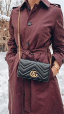 Model wearing High-End-Quality black Gucc! GG Marmont Mini Bag with aged gold-tone chain strap