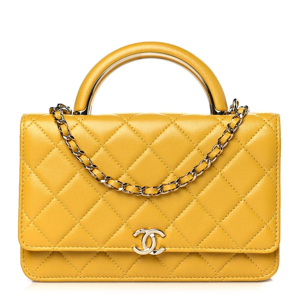 Front view of the yellow Ch@nel Wallet on Chain bag with CC detail and top handle