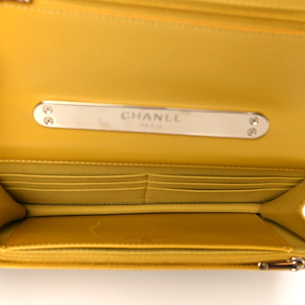 Yellow interior of the Wallet on Chain bag with card slots, zipper and patch pocket