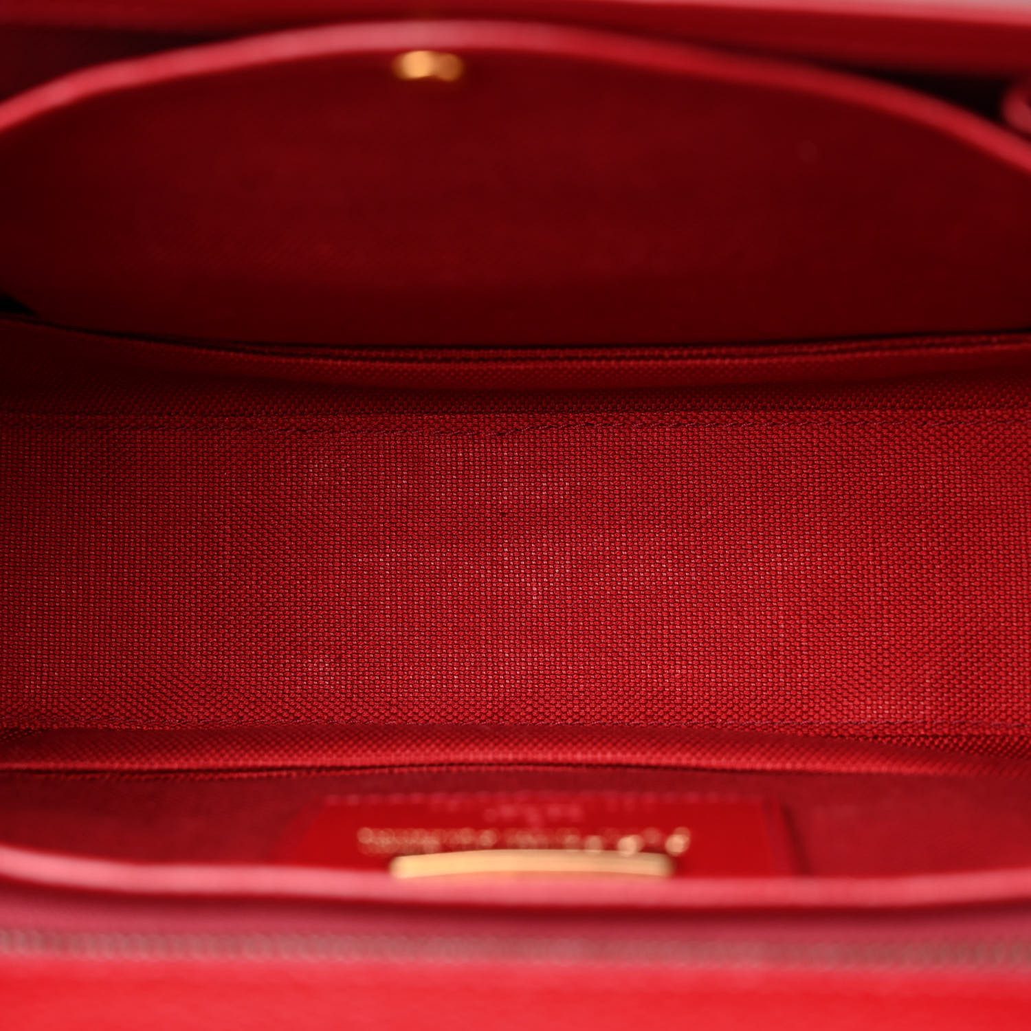 Interior of the Gucc! Bamboo Medium 1947 Top Handle Bag with natural fabric lining and patch pocket
