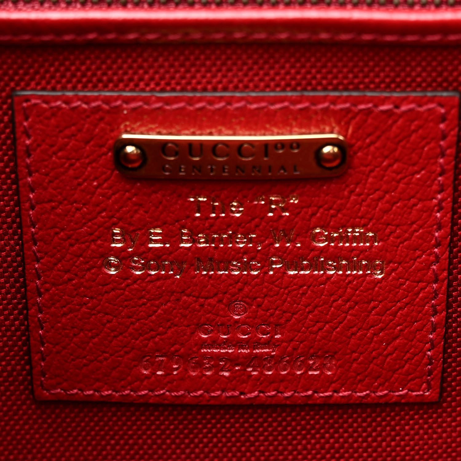 Close-up of the bamboo turn lock and brass-tone hardware on the Gucc! Bamboo 1947 Top Handle Bag