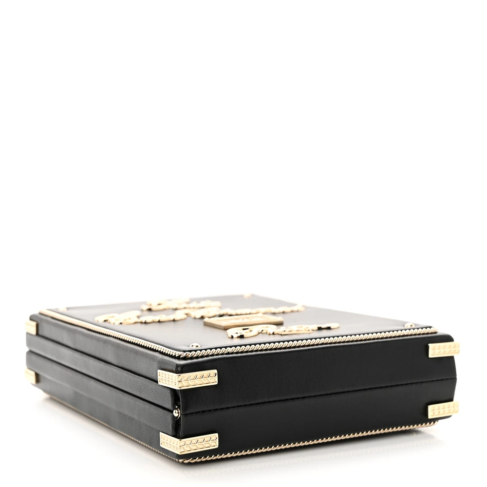 Bottom view of the black Ch@nel Room Card Minaudiere bag with textured kiss-lock closure