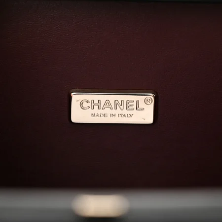 Burgundy fabric interior of the black Room Card Minaudiere bag