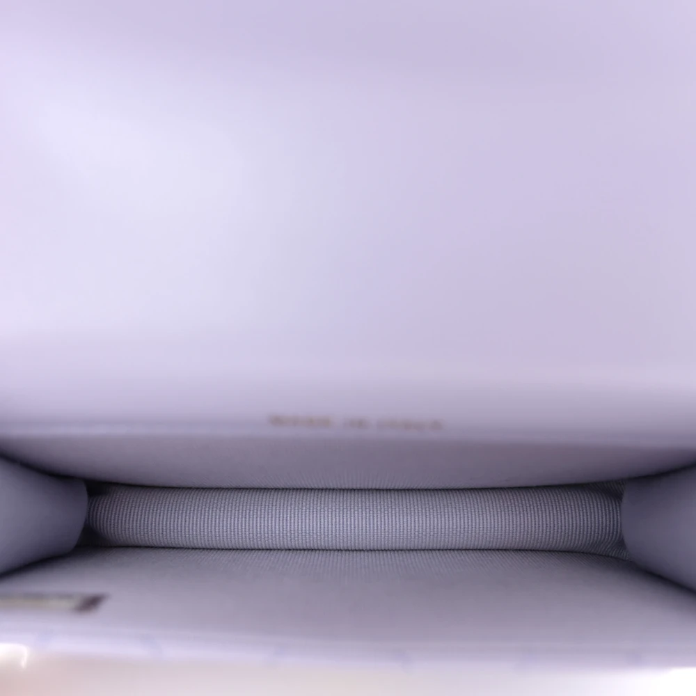 Matching fabric interior of the light purple coin purse bag for small essentials