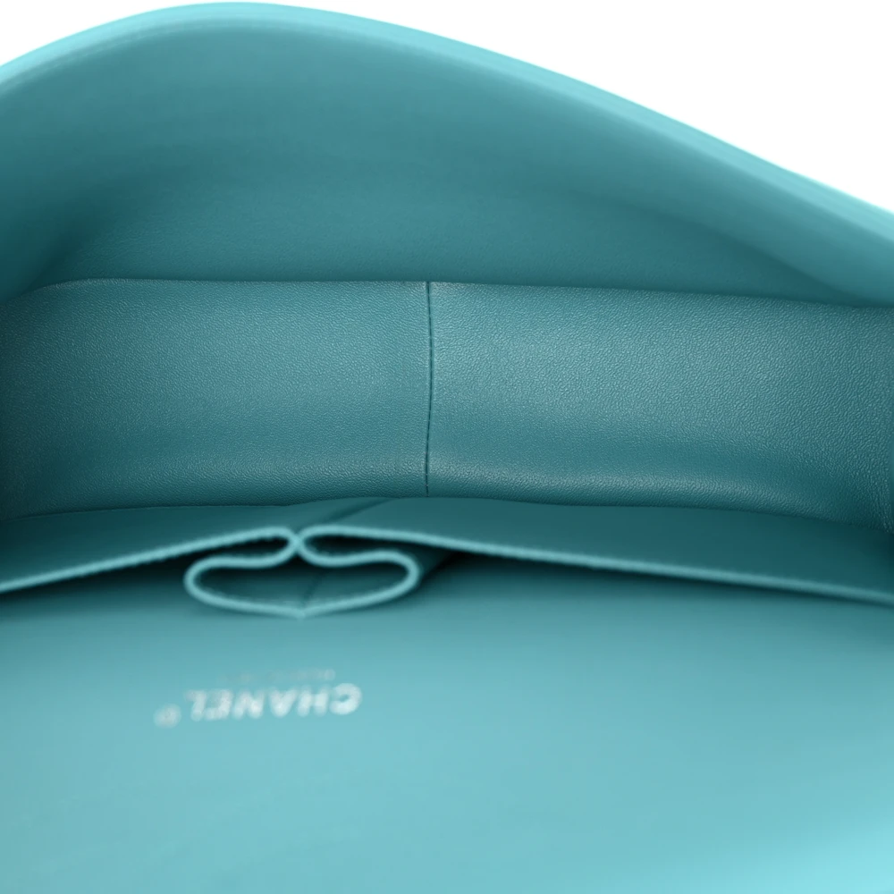 Turquoise leather interior of the Jumbo Flap bag with patch pockets