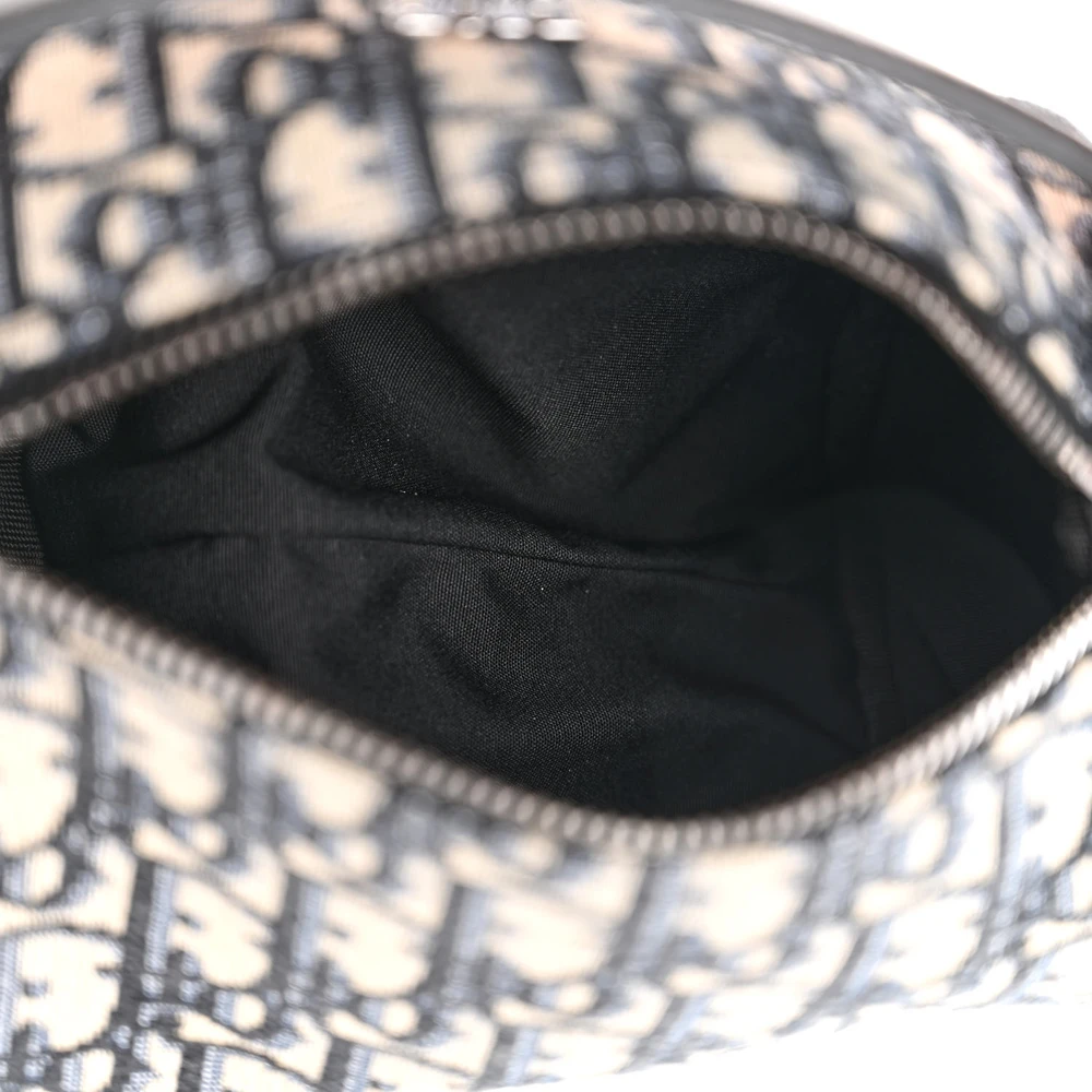 Interior view of the D!0r Mini Roller Messenger Bag with black fabric lining and zipper closure