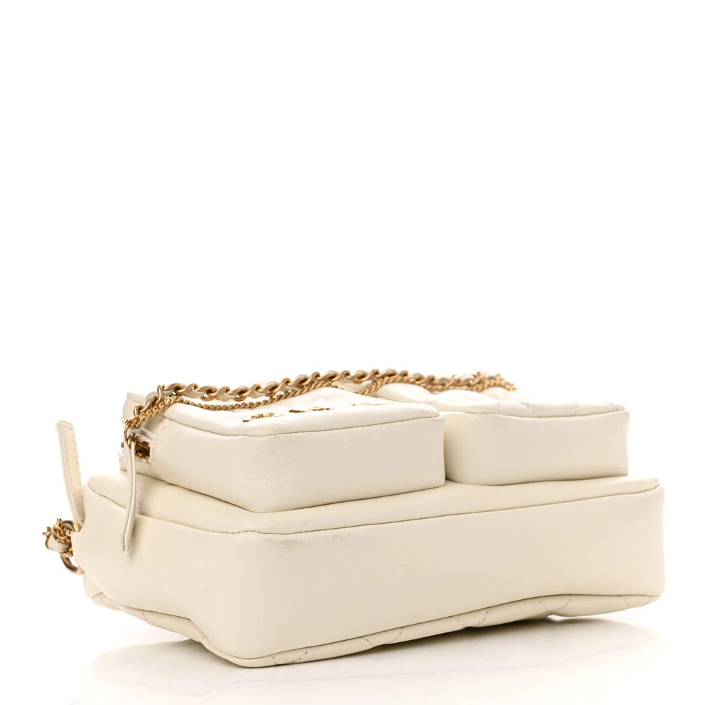 Bottom view of the superfake white Ch@nel Camera Case bag with front pocket and CC detail