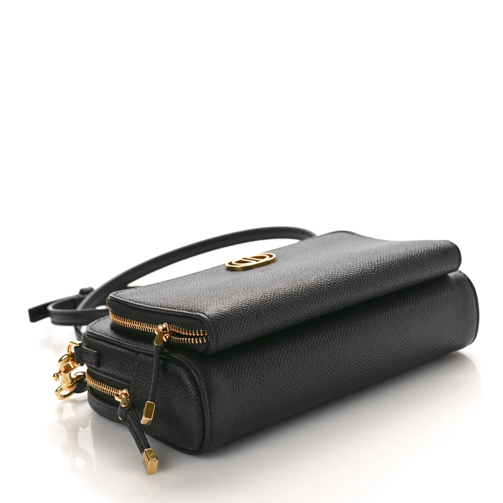 Bottom view of the black D!0r Caro Double Pouch with gold CD logo and leather strap