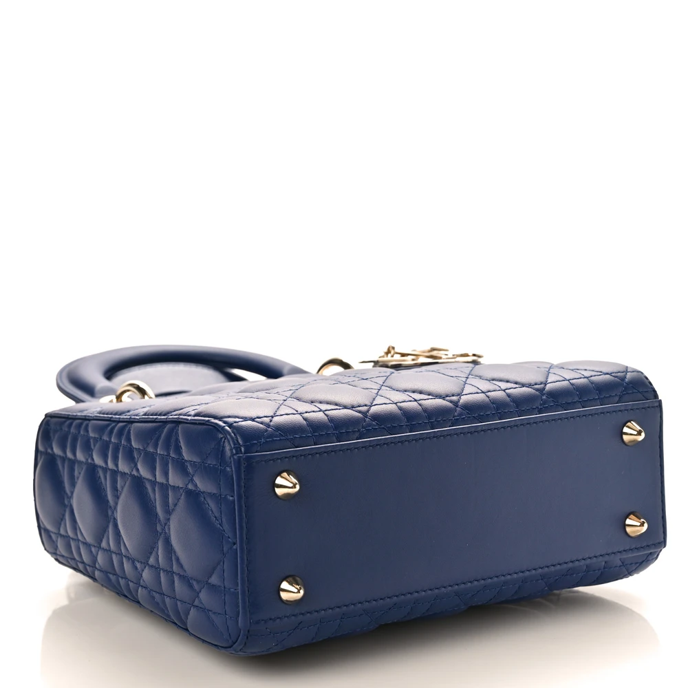Bottom view of the blue royale D!0r small Lady Bag with Cannage quilting and Dior charm