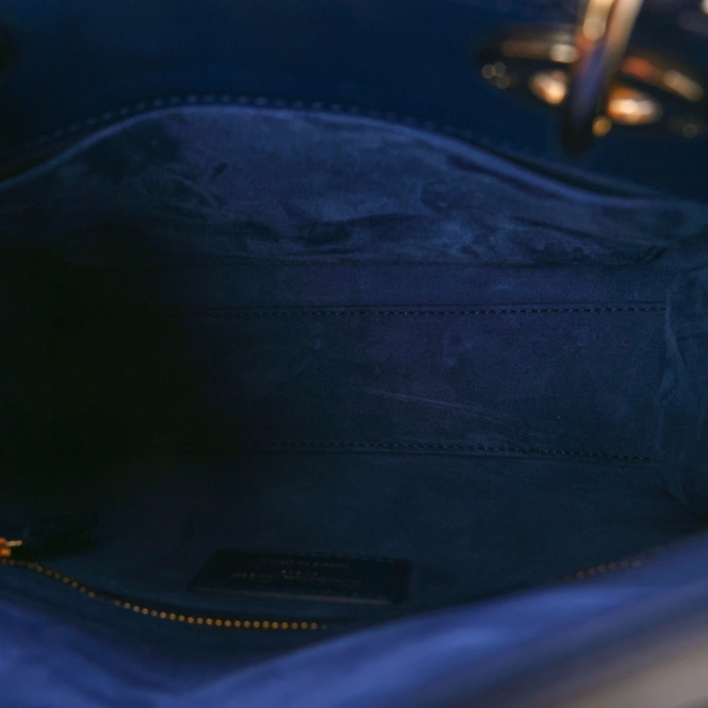 Blue fabric interior of the D!0r small Lady Bag with zipper and patch pockets