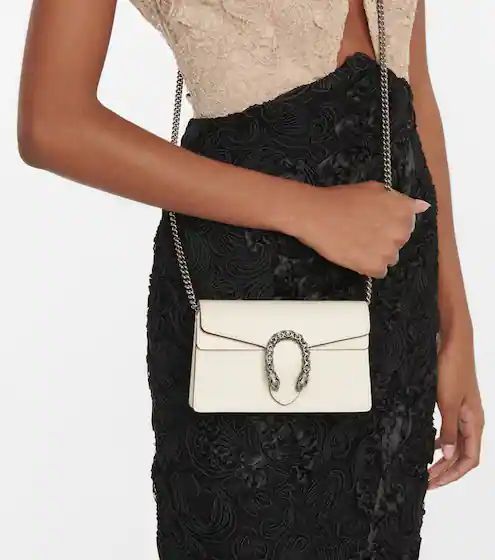 Model wearing the SuperFake Mystic White Gucc! Dionysus Small Shoulder Bag with silver-tone chain strap