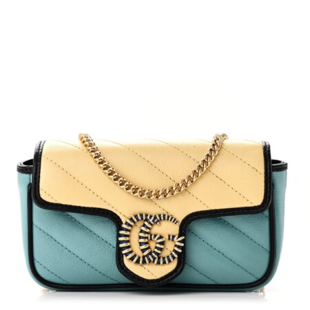 Front view of the Superfake Gucc! GG Marmont Super Mini Bag with blue and yellow leather panels and gold torchon GG closure
