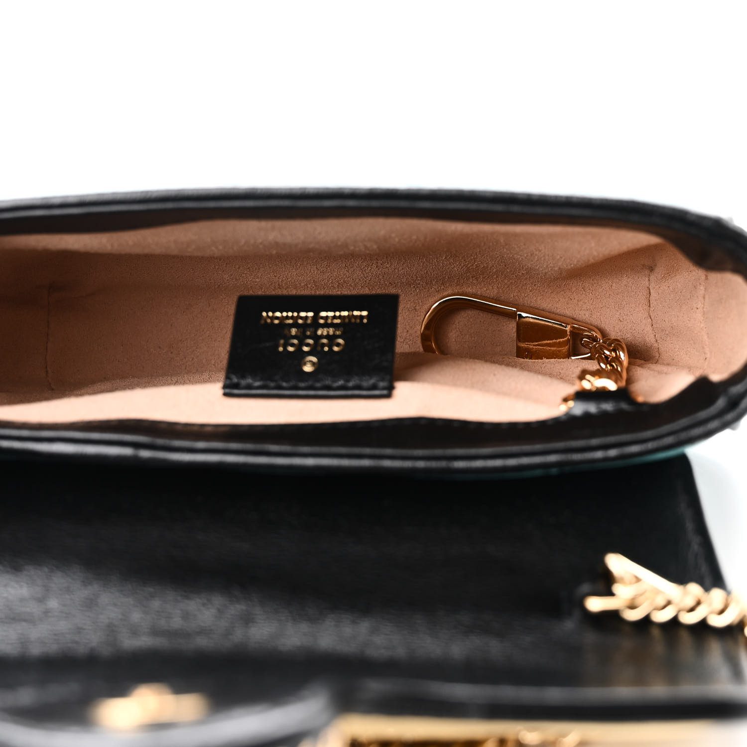 Interior of the Gucc! GG Marmont Super Mini Shoulder Bag with beige microfiber lining