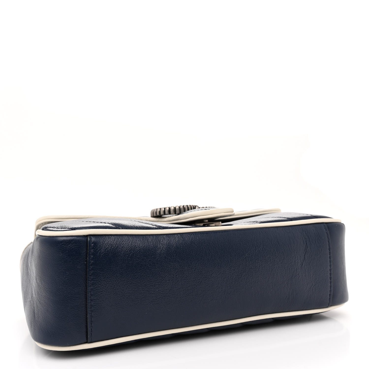Bottom view of the superfake blue Gucc! GG Marmont Small Shoulder Bag with white trim and textured silver-tone GG logo